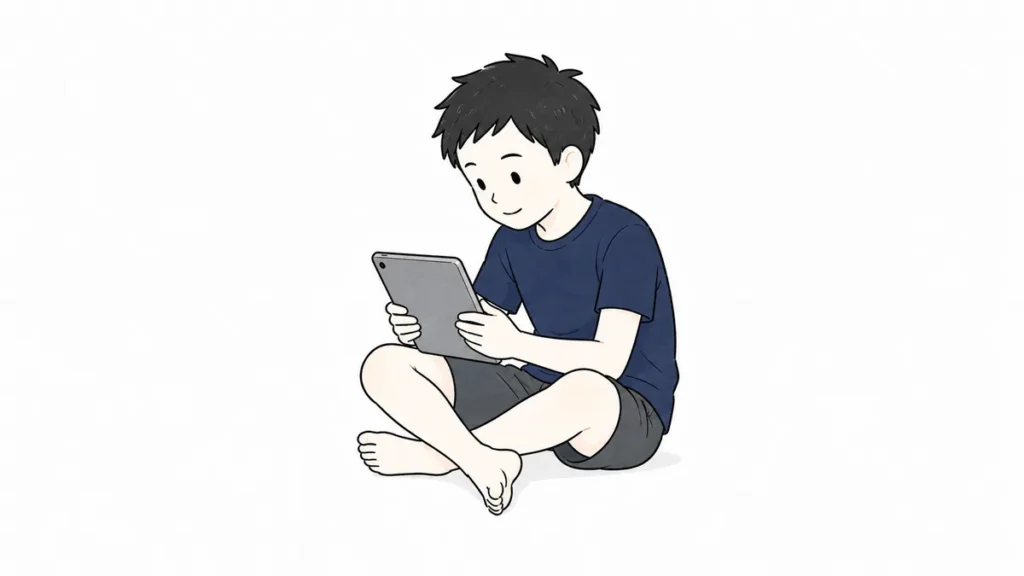 タブレットを座って使う子供のイメージ